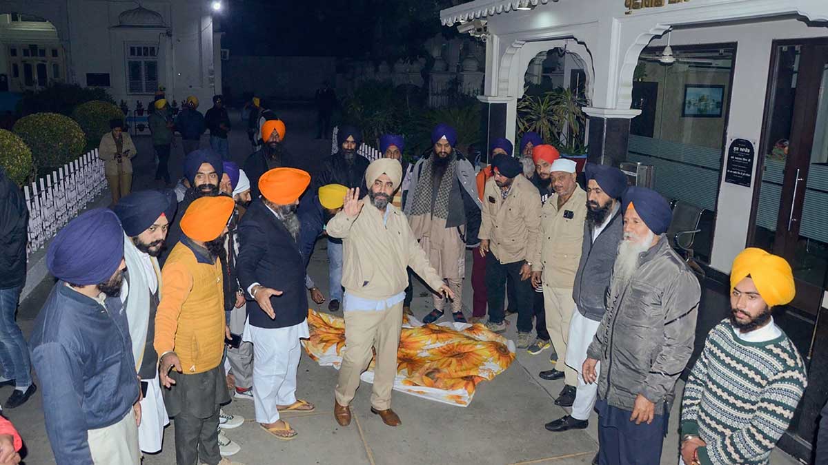 Activists of various Sikh organisations gather outside the Golden Temple after a man was beaten to death at the temple premises for alleged sacrilege, in Amritsar. (PTI)