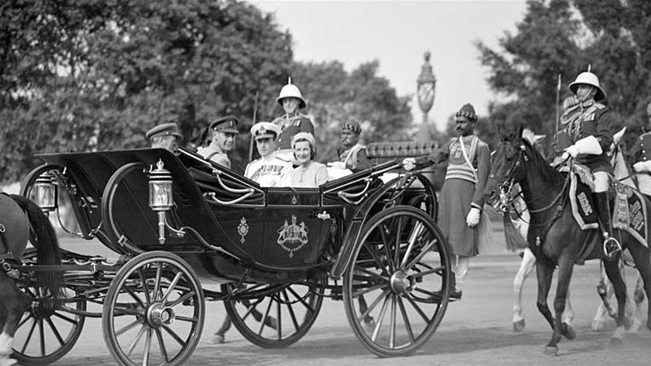 Lord Louis Mountbatten the last Viceroy of India and his wife Lady Edwina Mountbatten ride in the state carriage towards the Viceregal lodge in New Delhi on March 22 1947