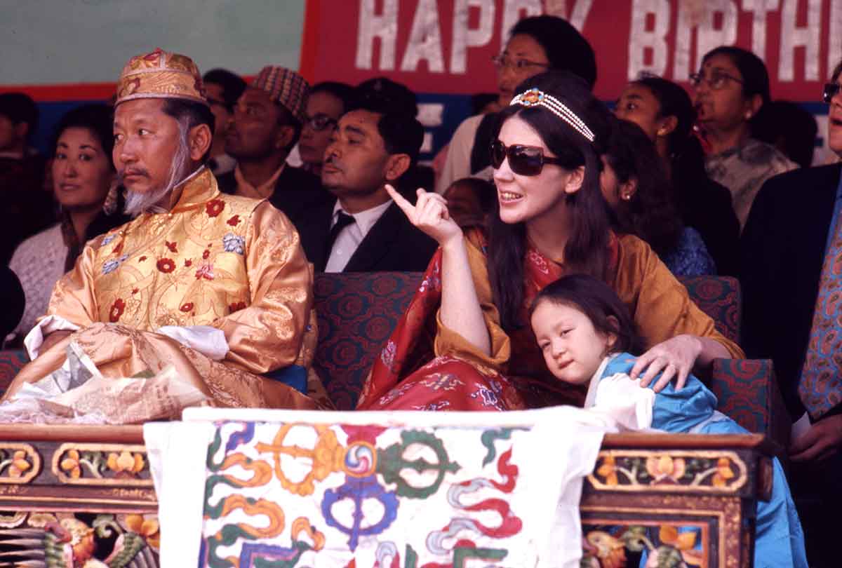 The 12th Chogyal (King) of Sikkim and his Gyalmo (Queen consort), Hope Cooke, with their daughter, Hope Leezum, watch birthday celebrations in Gangtok, Kingdom of Sikkim